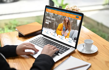 Credit union website displayed on desktop showing custom CMS dashboard